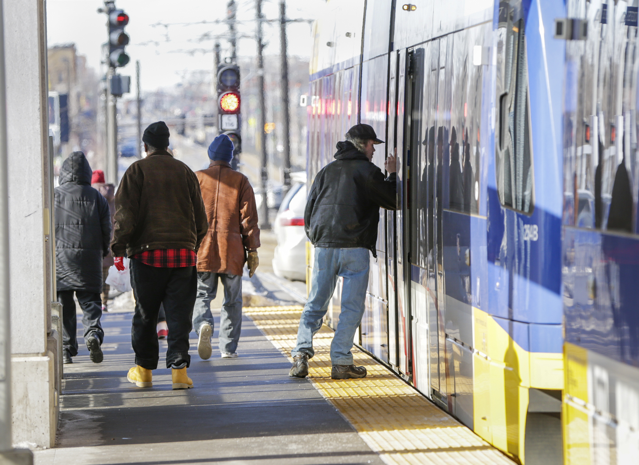 Metro Transit light rail riders exit an eastbound train at the State Capitol station Feb. 5. Lawmakers say ensuring security on Metro Transit light rail trains is a priority this session. Photo by Paul Battaglia